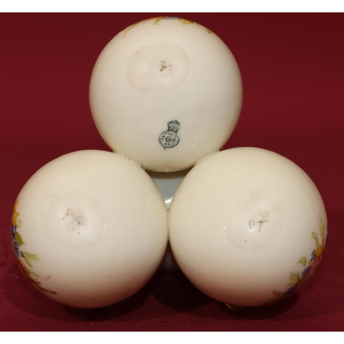 72 - A Royal Worcester vase in the form of 4 balancing bulbous 2-handled vases on white and gilt ground w... 