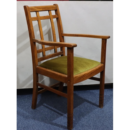 720 - A Heals oak carving chair with green velvet drop-in seat, on square legs with part fluting to ends, ... 