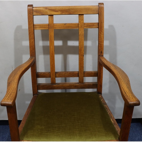 720 - A Heals oak carving chair with green velvet drop-in seat, on square legs with part fluting to ends, ... 