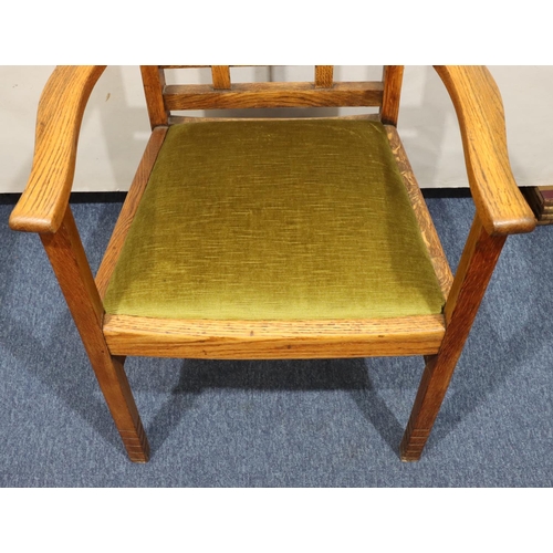 720 - A Heals oak carving chair with green velvet drop-in seat, on square legs with part fluting to ends, ... 