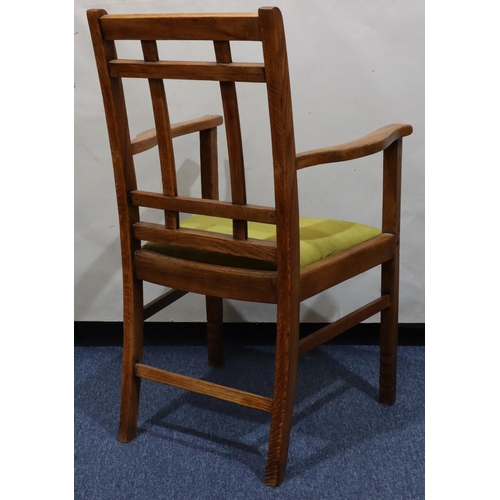 720 - A Heals oak carving chair with green velvet drop-in seat, on square legs with part fluting to ends, ... 