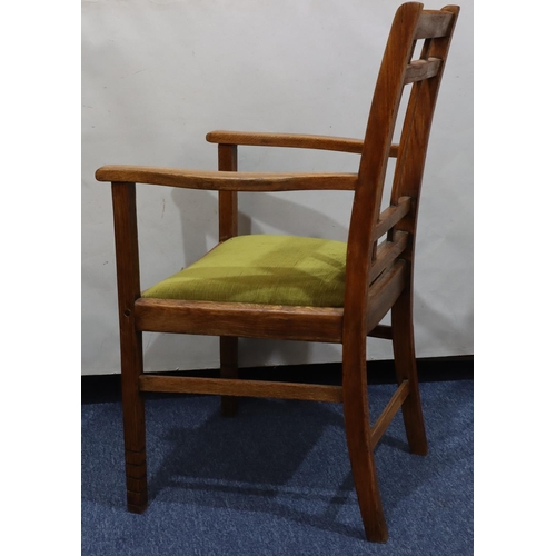 720 - A Heals oak carving chair with green velvet drop-in seat, on square legs with part fluting to ends, ... 