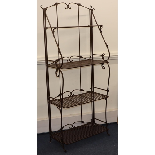 721 - A modern wrought iron collapsible 4-tier open bookcase with scroll supports, 77.5cm wide, 39cm deep,... 