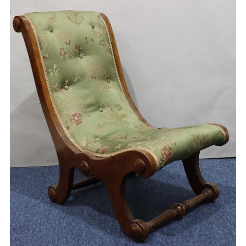 722 - A mahogany slipper nursing chair with green buttoned overstuffed seat and back, on splayed legs.