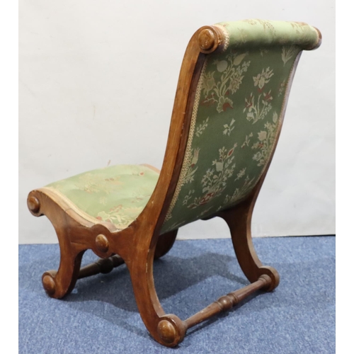 722 - A mahogany slipper nursing chair with green buttoned overstuffed seat and back, on splayed legs.