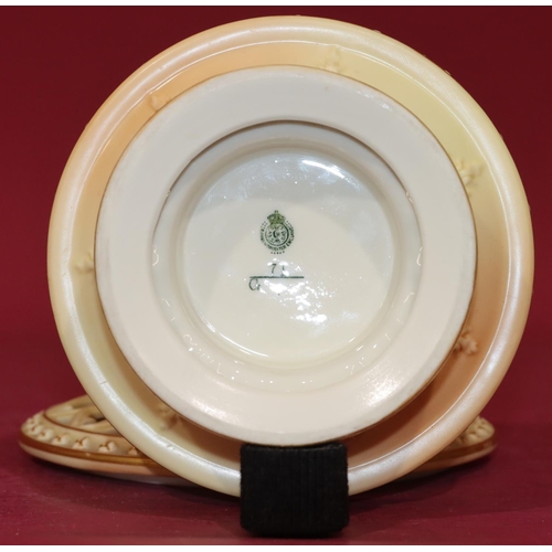 82 - A Royal Worcester Blush round flower bowl with separate pierced top and raised floral and leaf decor... 