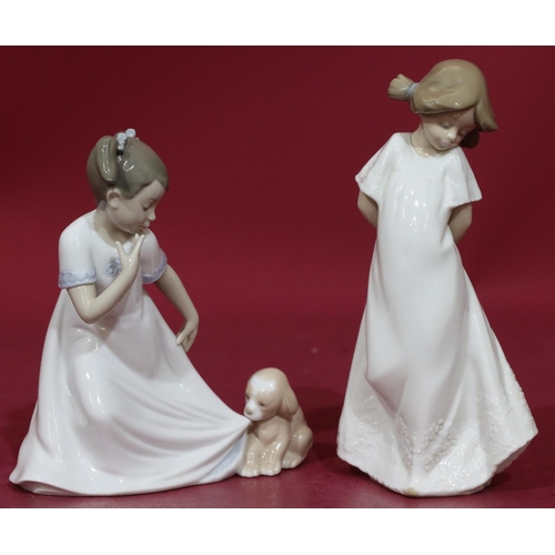 87 - A Nao figure of a young girl with puppy pulling at her nightdress, 17cm high and another Nao figure ... 