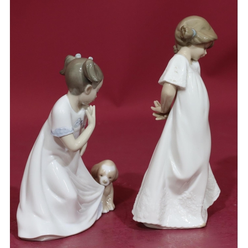 87 - A Nao figure of a young girl with puppy pulling at her nightdress, 17cm high and another Nao figure ... 