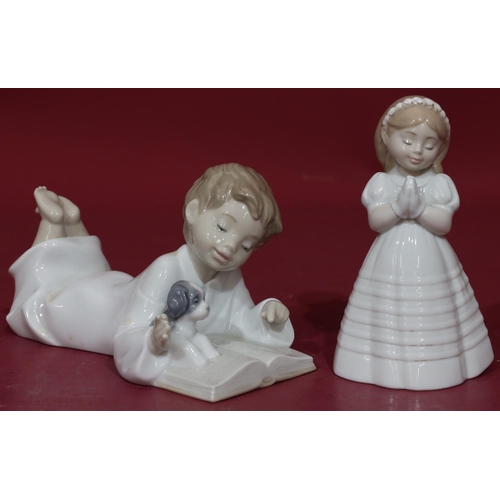 89 - A Nao figure of a lying boy reading a book with puppy, 19cm long and a Nao figure of a young girl in... 