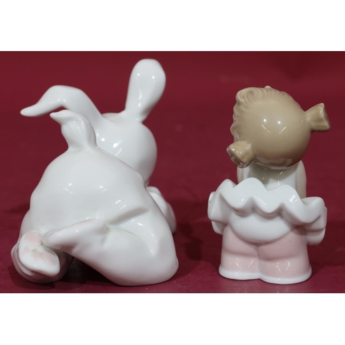 90 - A Nao figure of a young baby in rabbit's costume holding a bird, 15cm long and a similar Nao figure ... 