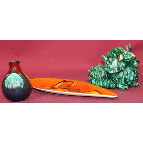 94 - A Poole dish on vibrant orange and yellow ground, 44cm long, a small Poole round bulbous thin necked... 