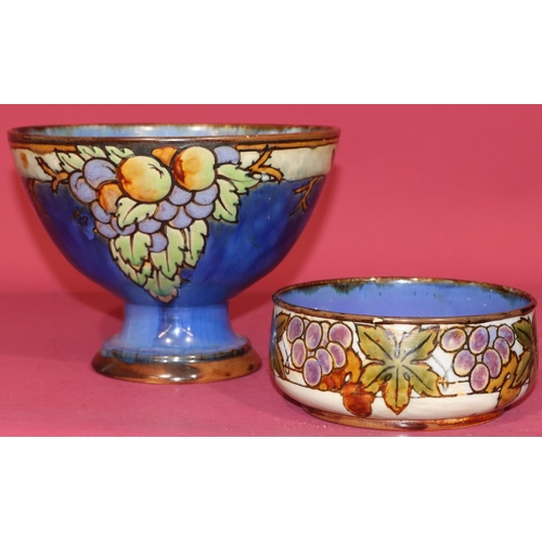 97 - A Royal Doulton glazed earthenware trumpet shaped fruit bowl on blue ground with multi-coloured frui... 