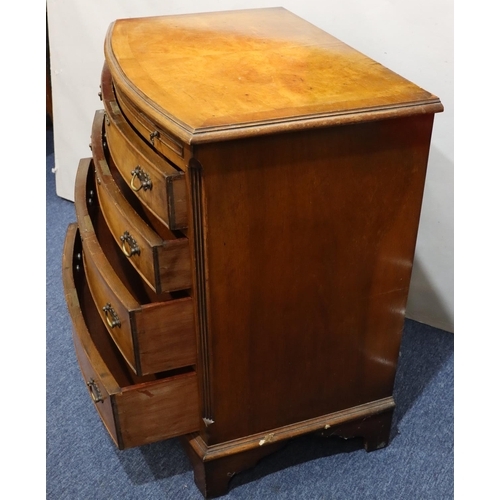 718 - A reproduction walnut small bow fronted chest of drawers with brush slide above 4 long graduated dra... 