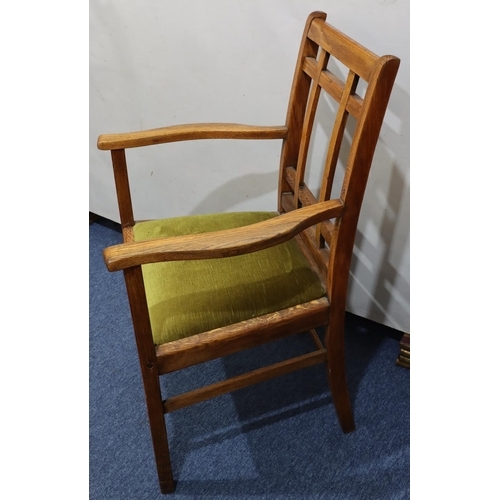 720 - A Heals oak carving chair with green velvet drop-in seat, on square legs with part fluting to ends, ... 