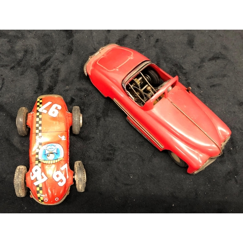 3305 - A Tri-Ang Mimic child's red plastic key wind car (no key), 17cm long and a red tin child's Indi 1000... 