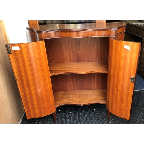 3322 - A mahogany serpentine fronted cupboard with 2 doors enclosing 1 shelf, 93cm wide, 35.5cm deep, 93.7c... 