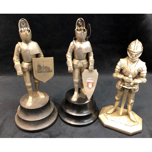 3326 - 3 novelty table lighters, in the form of a knight in armour, head lifts to reveal strike, a novelty ... 