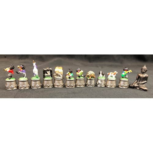 3330 - A quantity of various Warwick and other novelty thimbles, including Alice in Wonderland and small an... 