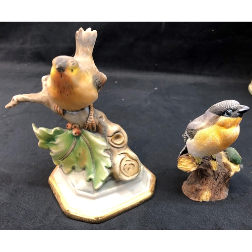 3341 - 2 Goebel style figures, a Capodimonte bird, 2 dog figures, a group of man and boy with barrow of pup... 