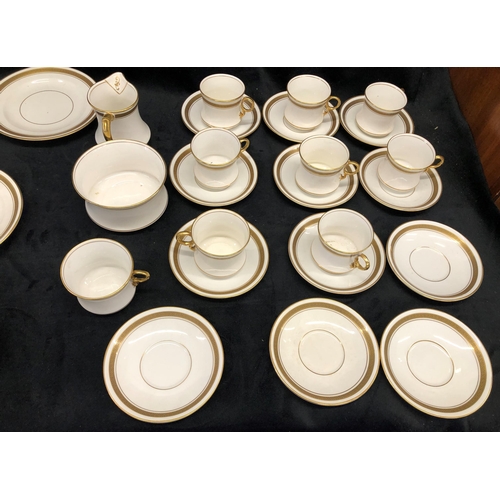 3366 - A Royal Staffordshire part service on white ground with gold coloured edging, 12 saucers, 8 cups, 1 ... 