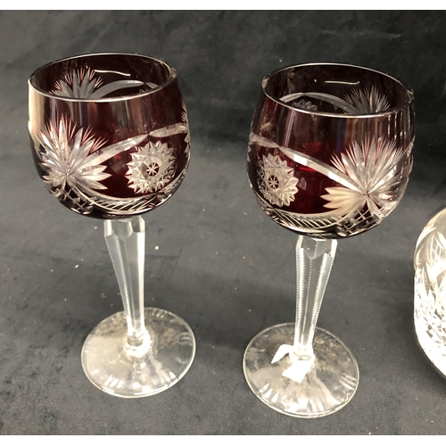 3379 - A set of 4 tall clear glass wine glasses with twist effect stems, 22cm high, a pair of red and clear... 