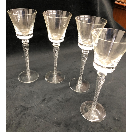 3379 - A set of 4 tall clear glass wine glasses with twist effect stems, 22cm high, a pair of red and clear... 