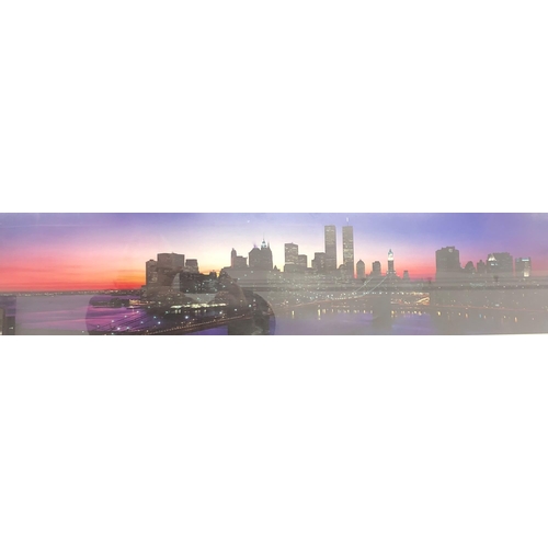 3386 - A coloured panoramic print of New York, in silver frame, 103.5cm x 36cm overall.