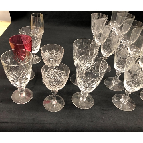 3400 - A set of 10 wine glasses with etched floral and leaf pattern 13cm high, 7 similar etched glasses wit... 