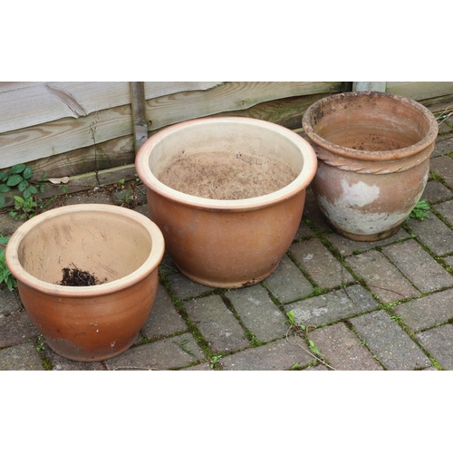 3411 - 3 modern round garden pots, 39cm diameter x 27cm high, 31cm diameter x 22cm high and 31.5cm diameter... 