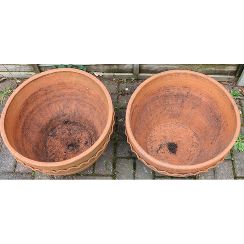 3413 - 2 modern terracotta round trumpet shaped garden pots with raised scallop shaped tops, 50cm diameter,... 