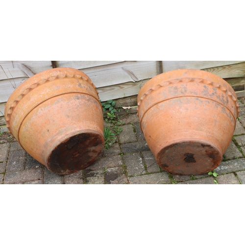 3413 - 2 modern terracotta round trumpet shaped garden pots with raised scallop shaped tops, 50cm diameter,... 