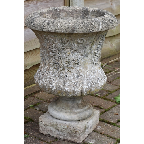 3414 - An urn shaped garden pot on square base with raised leaf and floral decoration, 49.5cm high, 36cm di... 