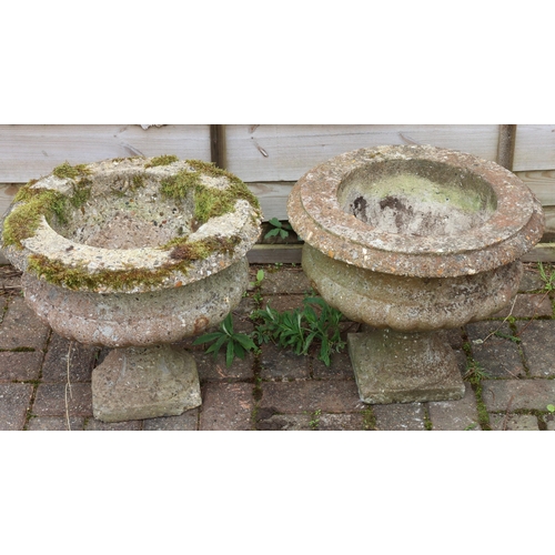 3415 - A pair of garden urns with bulbous bodies on square bases (1 base 2 corners a/f), 45cm diameter, 39c... 