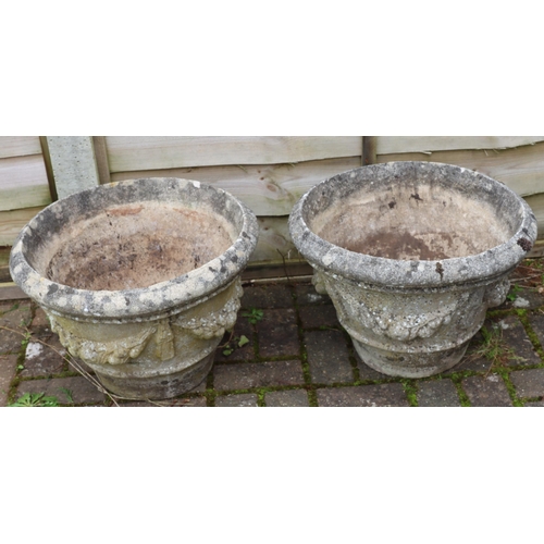 3416 - A pair of garden round trumpet shaped garden pots with raised swag and fruit sides, 50cm diameter, 3... 