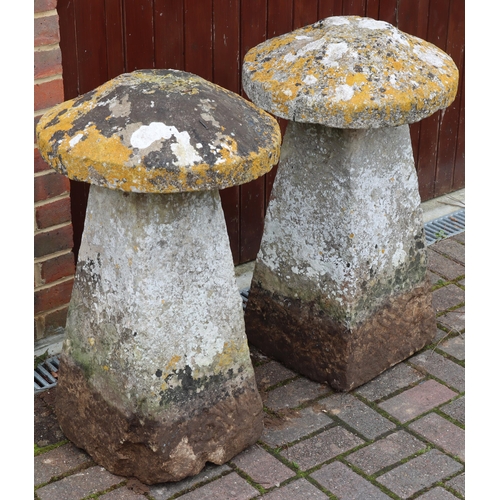 3417 - A pair of antique mushroom saddle stones in the form of mushrooms with circular tops on square splay... 