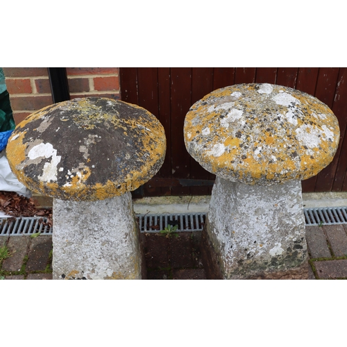 3417 - A pair of antique mushroom saddle stones in the form of mushrooms with circular tops on square splay... 