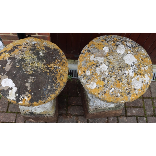 3417 - A pair of antique mushroom saddle stones in the form of mushrooms with circular tops on square splay... 