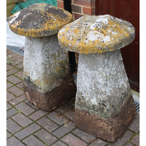 3417 - A pair of antique mushroom saddle stones in the form of mushrooms with circular tops on square splay... 