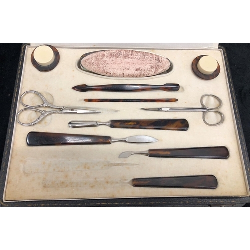 3258 - A boxed manicure set, tortoise shell style handles (3 original pieces missing) 1 non matching pair o... 