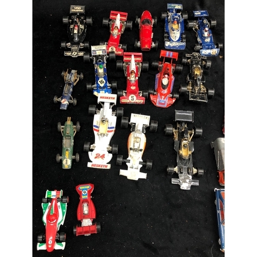 3284 - A quantity of various loose toy and model racing cars, vans, cars etc.