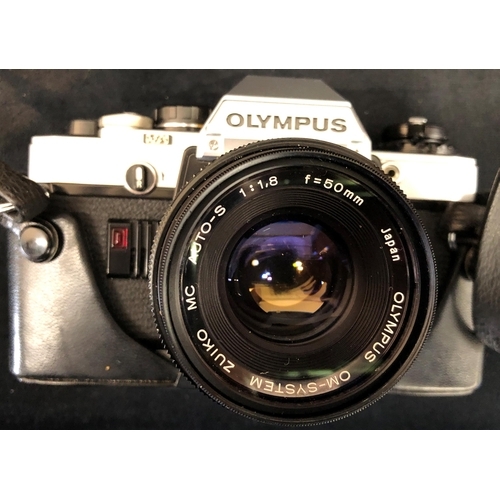 3331 - An Olympus OM 10 camera serial no. 1639755, with case, a Tamron f=135mm lens No. 5214814, a Vivitar ... 