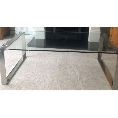 3433 - A glass rectangular topped coffee table on chrome supports, 110cm long, 60cm wide, 39cm high.