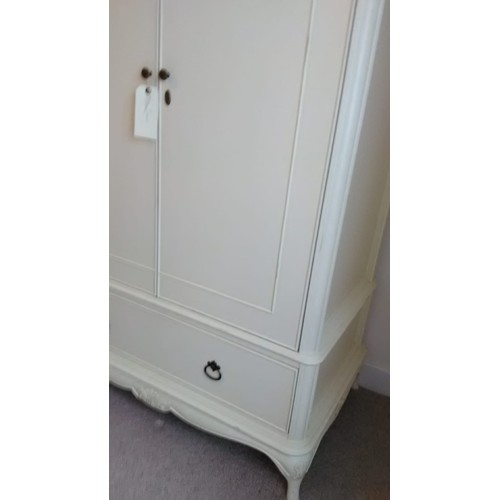 3556 - A Willis & Gambier white painted freestanding wardrobe, double panel doors enclosing hanging rail an... 