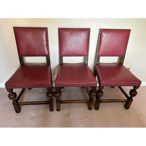 3559 - A set 12 oak dining chars, 4 carvers and 8 single, all with red leather seats and backs with stud de... 