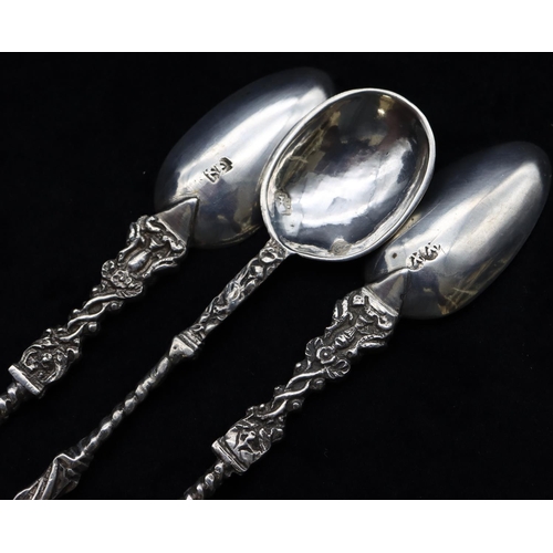 308 - A pair of Continental silver coloured metal Apostle teaspoons with twist stems and a similar smaller... 