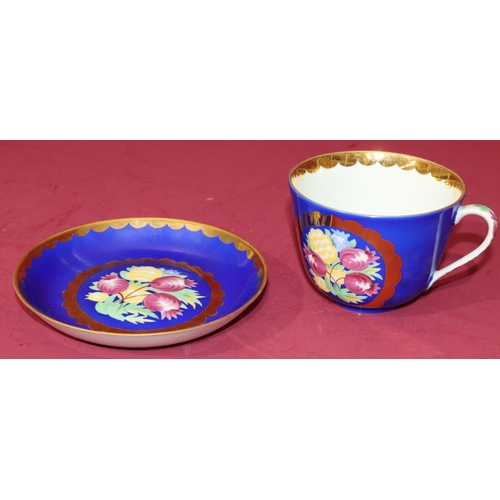 10 - Ayaebo Russian chocolate cup and saucer on white and blue ground with multi-coloured floral, leaf an... 