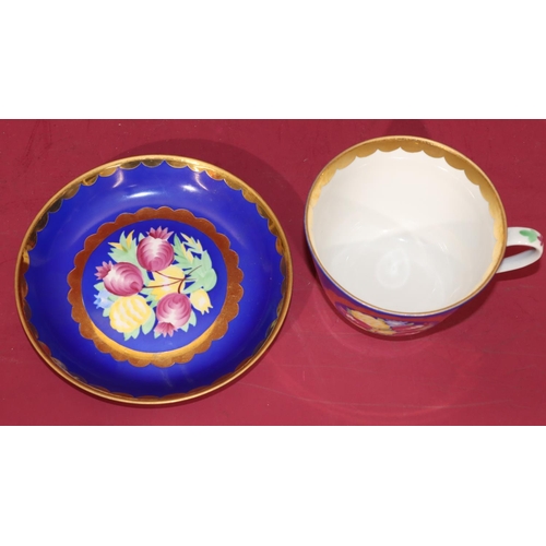 10 - Ayaebo Russian chocolate cup and saucer on white and blue ground with multi-coloured floral, leaf an... 