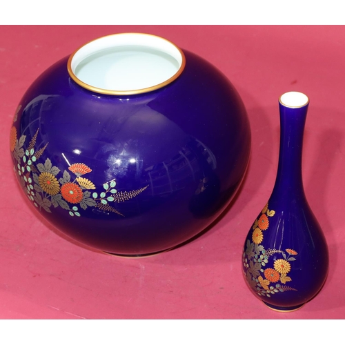 31 - An Oriental 20th Century round bulbous thin necked vase on royal blue ground with coloured floral, l... 