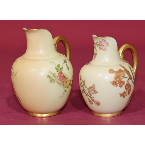 75 - A Royal Worcester Blush round bulbous shaped jug with multi-coloured floral, leaf and gilt decoratio... 