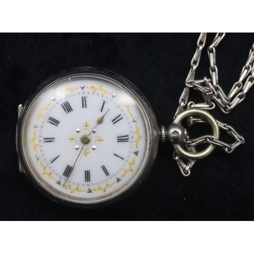 414 - A Continental silver circular fob watch with white enamel dial and Roman numerals, allover engraved ... 